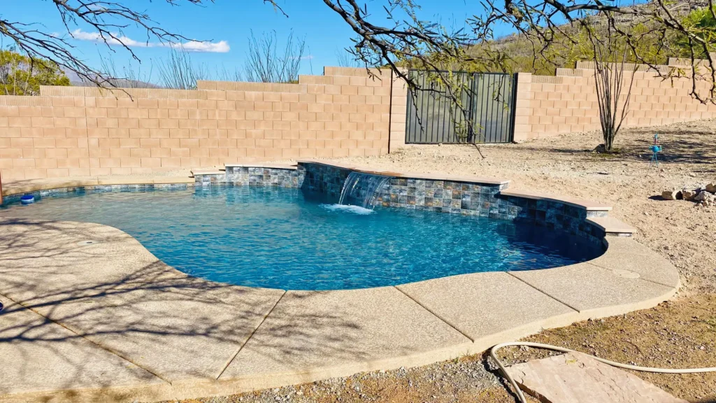Beautiful pool install with raised back wall by Smart Pool Builders, Tucson